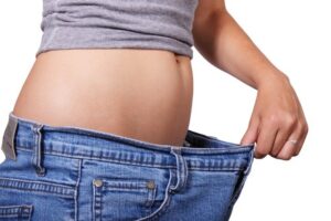 Image of Weight Loss Showing Jeans That are Too Large - CoffeyFit